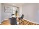 Cozy dining nook with modern chairs and marble-top table, illuminated by soft, natural lighting at 7100 E 5Th Ave, Denver, CO 80220