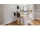 Kitchen eating area features updated light fixtures and marble countertops at 7100 E 5Th Ave, Denver, CO 80220