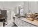 Bright, modern kitchen with stainless steel appliances, light cabinets, and sleek countertops for an inviting culinary space at 7100 E 5Th Ave, Denver, CO 80220