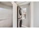 Convenient laundry area with stacked washer and dryer, optimizing space and functionality at 7100 E 5Th Ave, Denver, CO 80220