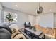 Well-lit living room showcasing hardwood floors, comfortable seating, and stylish decor, ideal for gatherings at 7100 E 5Th Ave, Denver, CO 80220