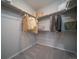 Walk-in closet with custom shelving and ample space for storage, including rods and shelves for organization at 21927 E 51St Dr, Aurora, CO 80019