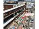 Aerial view of the building featuring a private rooftop deck with furniture and AC units at 2715 Blake St # 2, Denver, CO 80205