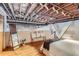 Bedroom featuring exposed wood ceiling, hardwood floors, sitting area, and a full-length mirror at 2715 Blake St # 2, Denver, CO 80205