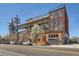 Unique multi-story building with exposed metal beams and rooftop terrace and attached pedestrian bridge at 2715 Blake St # 2, Denver, CO 80205