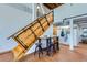 Hallway featuring industrial staircase, coat rack, and adjacent breakfast table with seating at 2715 Blake St # 2, Denver, CO 80205