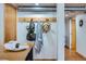 Hallway with coat rack, and adjacent breakfast table with seating at 2715 Blake St # 2, Denver, CO 80205