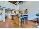 Bright kitchen with stainless steel appliances, black countertops, and island with seating at 2715 Blake St # 2, Denver, CO 80205