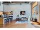 Open-concept living room featuring modern decor and a well-equipped kitchen with a breakfast bar at 2715 Blake St # 2, Denver, CO 80205
