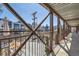Rooftop deck with seating and an outdoor rug, enclosed by metal framework, and city views at 2715 Blake St # 2, Denver, CO 80205