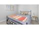 Bedroom featuring simple decor and a comfy queen-size bed at 6426 Zang Ct, Arvada, CO 80004
