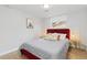 Comfortable bedroom with a plush bed, modern decor, and ample natural light from the window at 6426 Zang Ct, Arvada, CO 80004