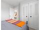 Bedroom featuring large closet and view into adjoining room at 6426 Zang Ct, Arvada, CO 80004