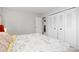 Bedroom featuring large closet and view into adjoining room at 6426 Zang Ct, Arvada, CO 80004