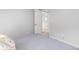 Simple bedroom featuring neutral walls and view into closet at 6426 Zang Ct, Arvada, CO 80004