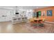 Eat-in kitchen featuring stainless appliances, new flooring, and island seating at 6426 Zang Ct, Arvada, CO 80004