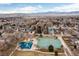 An aerial view featuring a neighborhood park with playground and tennis courts at 6426 Zang Ct, Arvada, CO 80004