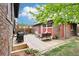 Backyard patio area featuring a grill, outdoor seating and dining area with an overhead pergola at 4253 Hooker St, Denver, CO 80211
