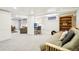 Spacious finished basement with neutral carpeting and versatile layout for living and office space at 4253 Hooker St, Denver, CO 80211