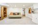 Finished basement with carpeting, futon, storage and art, perfect for a den or additional living space at 4253 Hooker St, Denver, CO 80211