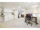 Finished basement area with carpet, cabinets, desk and chair, exercise bike, and recessed lighting at 4253 Hooker St, Denver, CO 80211