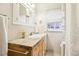 Bathroom featuring vanity with marble countertop and tiled walls at 4253 Hooker St, Denver, CO 80211
