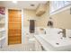Well-lit bathroom with a tiled floor, ample counter space, and classic fixtures at 4253 Hooker St, Denver, CO 80211