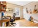 Bedroom featuring a desk and chair, and a decorative display of guitars at 4253 Hooker St, Denver, CO 80211
