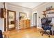 Bedroom featuring a wooden dresser with mirror and a desk with chair at 4253 Hooker St, Denver, CO 80211