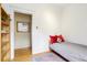 Bedroom featuring a twin bed and shelving unit at 4253 Hooker St, Denver, CO 80211