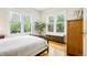 Cozy bedroom with natural light and hardwood floors at 4253 Hooker St, Denver, CO 80211