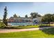 Community pool with slide and lawn, surrounded by fencing and benches on a sunny day at 4253 Hooker St, Denver, CO 80211