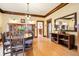 Traditional dining room featuring hardwood floors, classic lighting, and ample space for gatherings at 4253 Hooker St, Denver, CO 80211