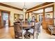 Open dining room featuring hardwood floors, natural light, and a large dining table at 4253 Hooker St, Denver, CO 80211