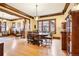 Spacious dining room featuring hardwood floors, wood trim, and seamless access to other living spaces at 4253 Hooker St, Denver, CO 80211