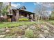 A well-maintained brick home with lush landscaping, beautiful flower beds, and green lawn at 4253 Hooker St, Denver, CO 80211