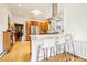 Bright kitchen boasts stainless steel appliances, granite countertops, and a convenient breakfast bar with seating at 4253 Hooker St, Denver, CO 80211