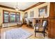 Bright living room featuring hardwood floors, natural light, and classic wood trim at 4253 Hooker St, Denver, CO 80211