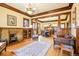 Open-concept living area with hardwood floors, brick fireplace, and natural light at 4253 Hooker St, Denver, CO 80211