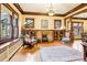 Cozy living room with beautiful hardwood floors, built-in shelving, and a brick fireplace at 4253 Hooker St, Denver, CO 80211