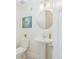 Clean powder room with pedestal sink and black and white floor at 3321 W Clyde Pl, Denver, CO 80211