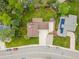 Aerial view of the home featuring a backyard, a driveway and a spacious, well-manicured lawn at 5954 W Leawood Dr, Littleton, CO 80123