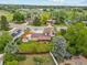 An aerial view shows mature trees, a well-manicured lawn, and convenient neighborhood location at 5954 W Leawood Dr, Littleton, CO 80123