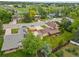 An aerial view highlights this well-manicured property with a large yard and mature trees at 5954 W Leawood Dr, Littleton, CO 80123