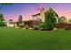 A well-maintained lawn highlights the home with a shed and a cozy covered patio at 5954 W Leawood Dr, Littleton, CO 80123