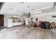 Spacious garage with ample storage, shelving, and workbench at 5954 W Leawood Dr, Littleton, CO 80123