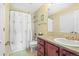 Cozy bathroom features a shower over tub and a solid surface vanity with ample counter space at 7859 S Coolidge Way, Aurora, CO 80016