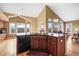 Open kitchen, including an island, with abundant light and views at 7859 S Coolidge Way, Aurora, CO 80016