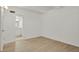 A bright bedroom with a large window and doorway to adjacent bathroom at 9725 E Harvard Ave # 305, Denver, CO 80231