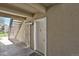 This image showcases a secure entry area with a white door and a metal security gate at 9725 E Harvard Ave # 305, Denver, CO 80231